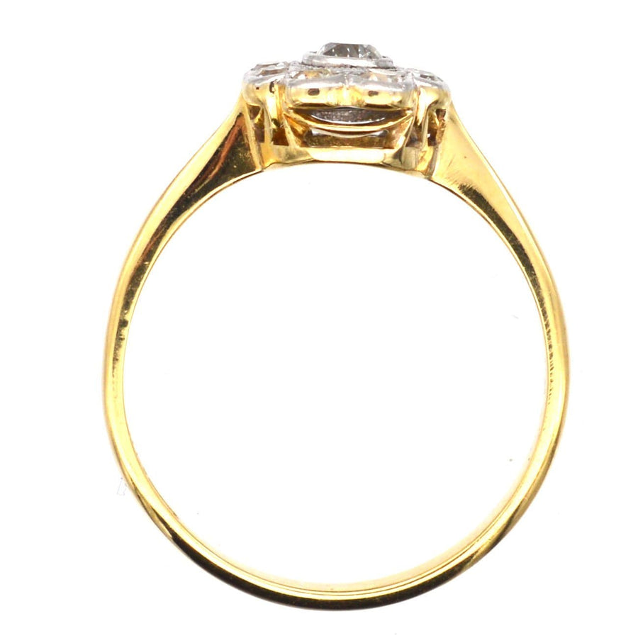 Art Deco 18ct gold and platinum diamond cluster ring, featuring a central diamond and exquisite millegrain setting.