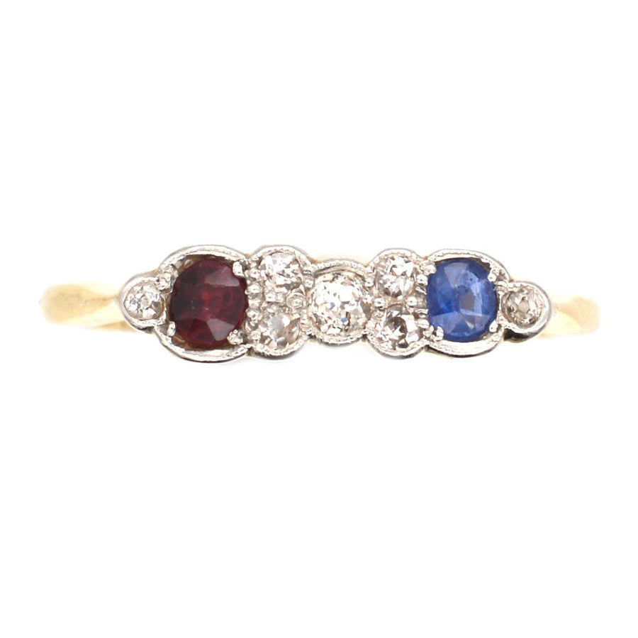 Art Deco 18ct gold and platinum ring featuring ruby, sapphire, and diamonds, perfect for unique engagement or fashion wear.