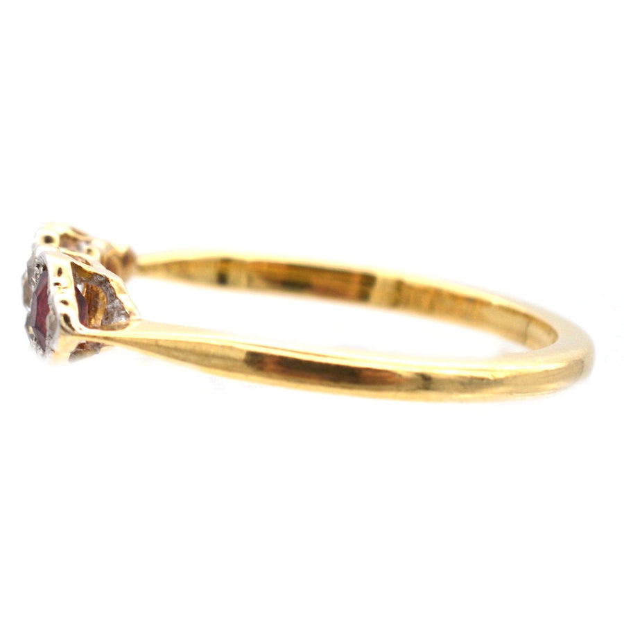 Art Deco 18ct gold ring with oval ruby, sapphire, and sparkling diamonds side view.