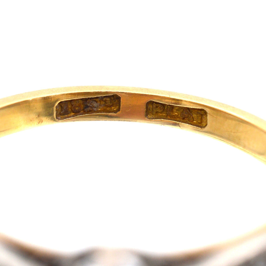 Interior view of an 18ct gold ring showing the hallmarks and craftsmanship.
