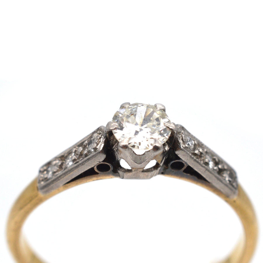 Art Deco 18ct gold and platinum diamond solitaire ring with diamond shoulders, circa 1920s, 0.25 carats.