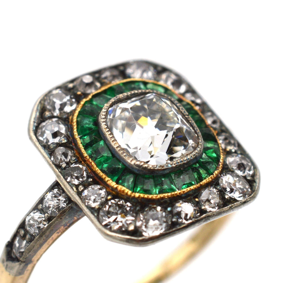 Art Deco 18ct gold and platinum ring featuring emeralds and a 0.80ct old mine cut diamond, hallmark 1925.