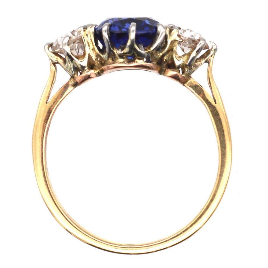 Art Deco 18ct gold and platinum three stone ring featuring sapphire and diamond accents, ideal for engagement.