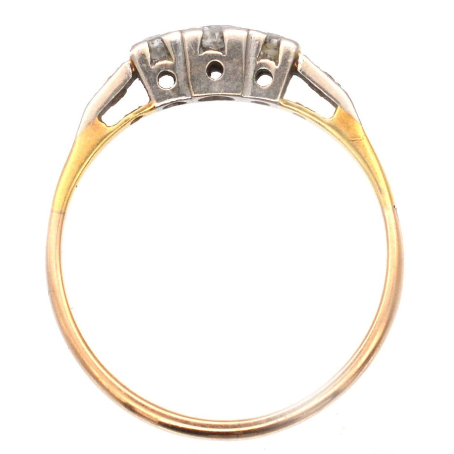 Art Deco 18ct gold and platinum three stone diamond ring with elegant square settings.