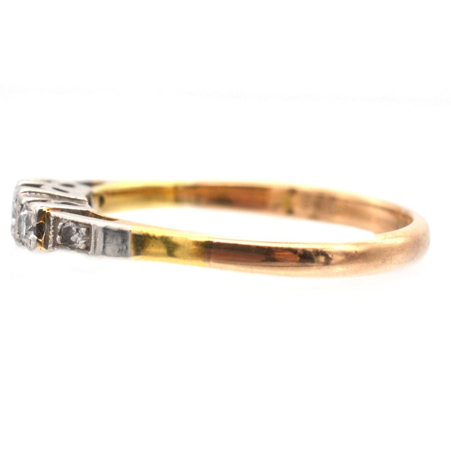 Art Deco 18ct gold and platinum three stone diamond ring with diamond shoulders, featuring stylish square settings.
