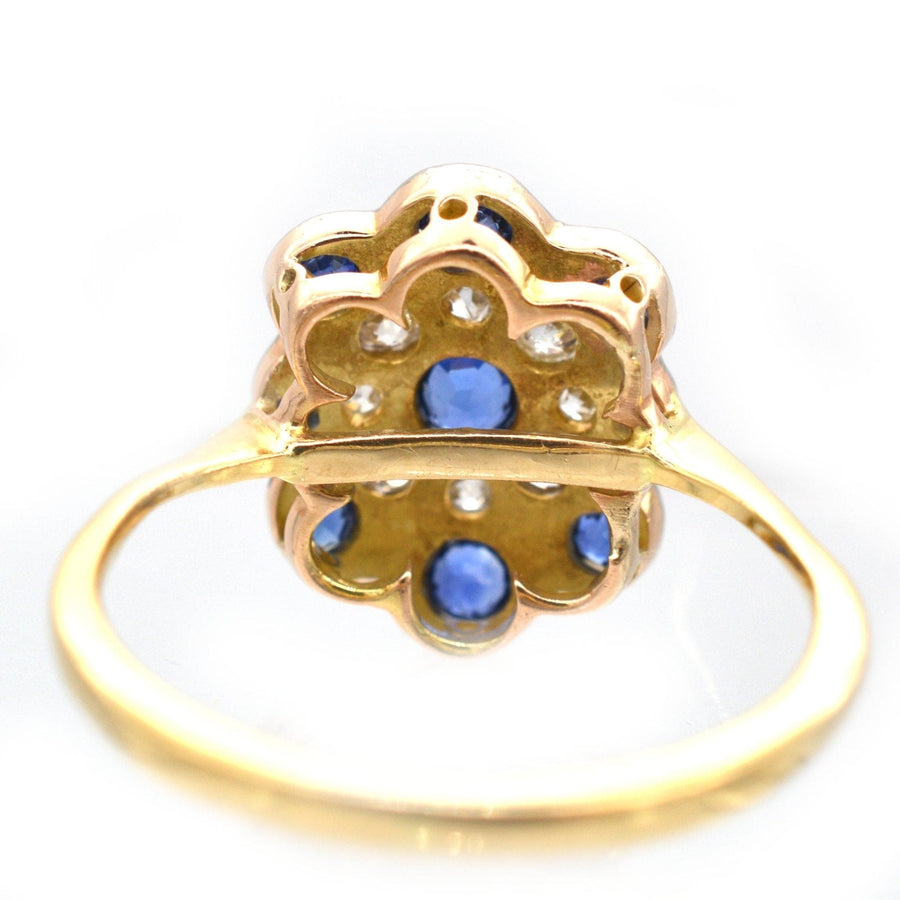 Art Deco 18ct gold ring featuring a cluster of sapphires and diamonds, viewed from the back.