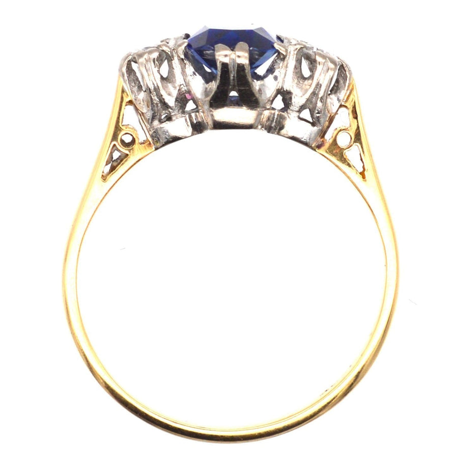 Art Deco 18ct gold ring featuring a large sapphire and two diamond stones, perfect for engagement.