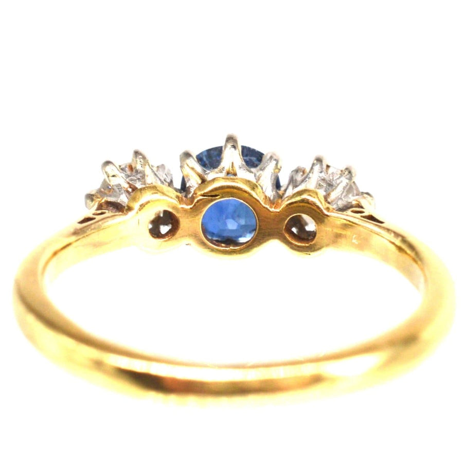 Art Deco 18ct gold three stone ring with sapphire and diamonds, size K, perfect for engagement or special occasions.