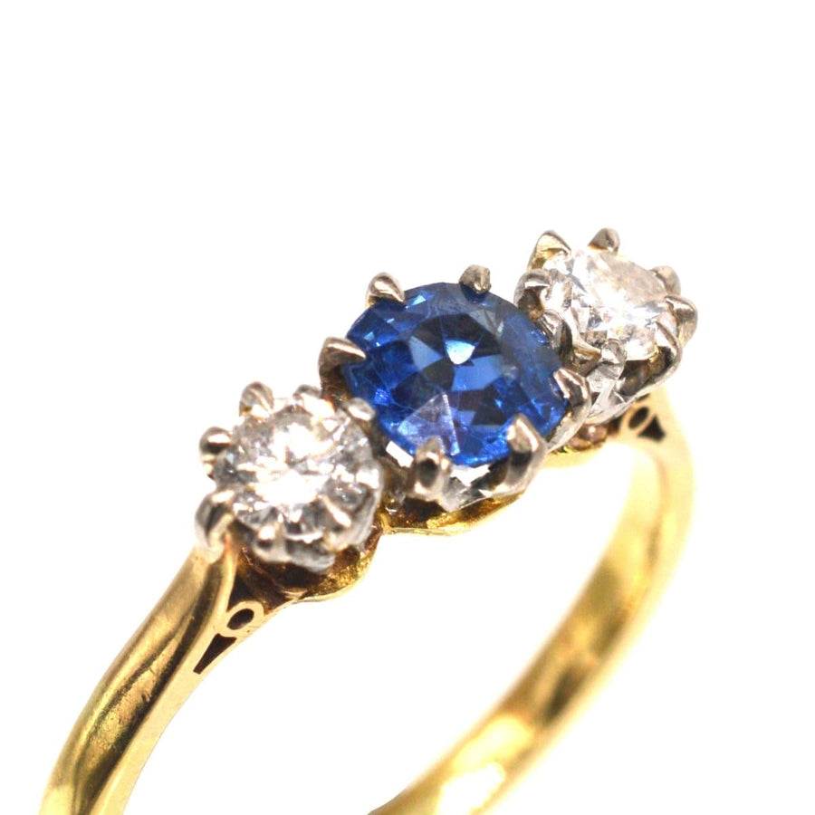 Art Deco 18ct gold three stone ring with blue sapphire and diamond accents, perfect for engagement.