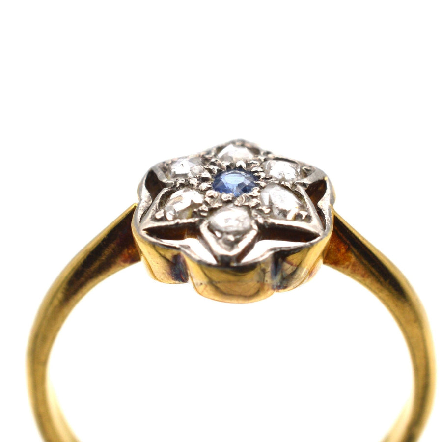 Art Deco 18ct & Platinum ring featuring a diamond and sapphire flower star design.