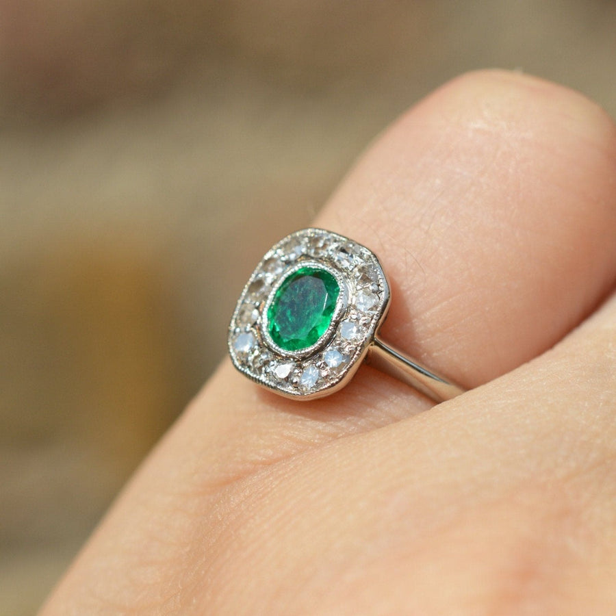 Art Deco 18ct white gold ring featuring vibrant emerald and diamond cluster, perfect for an engagement ring.
