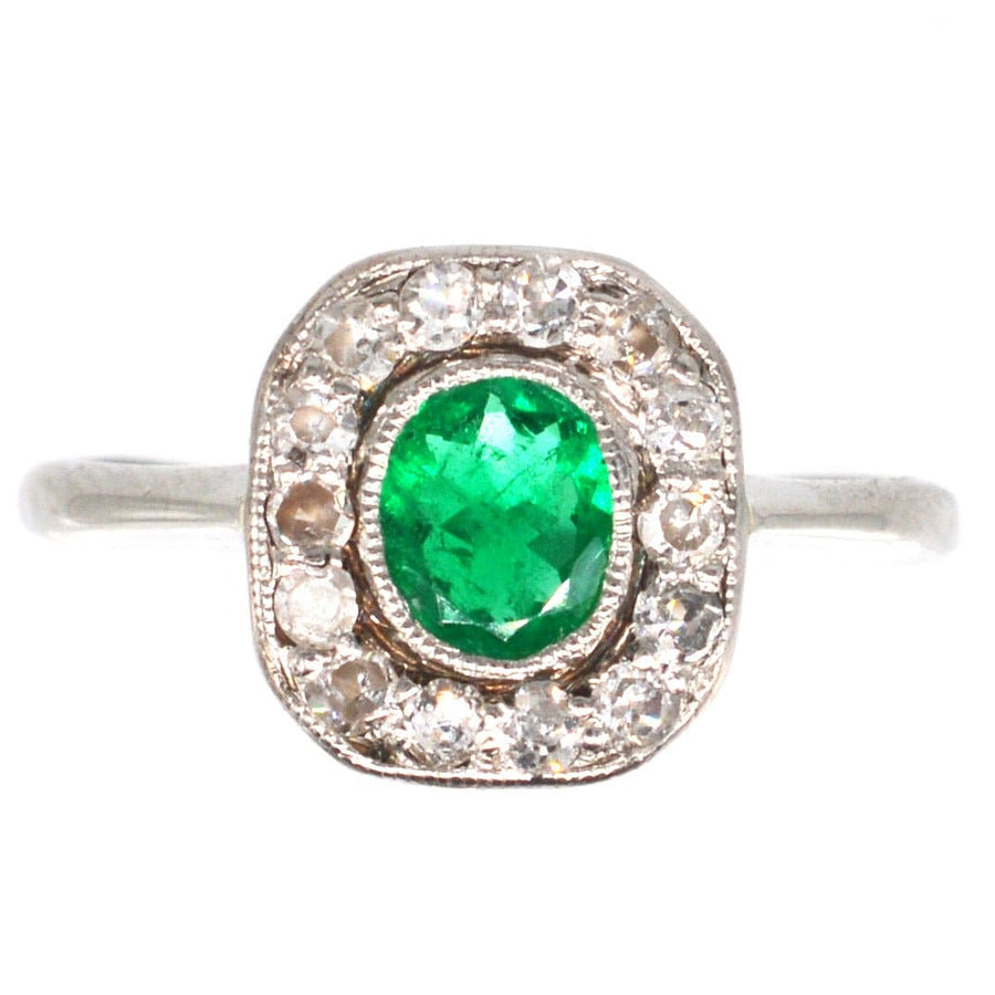 Art Deco 18ct white gold emerald and diamond cluster ring with vibrant green emerald and sparkling diamonds.