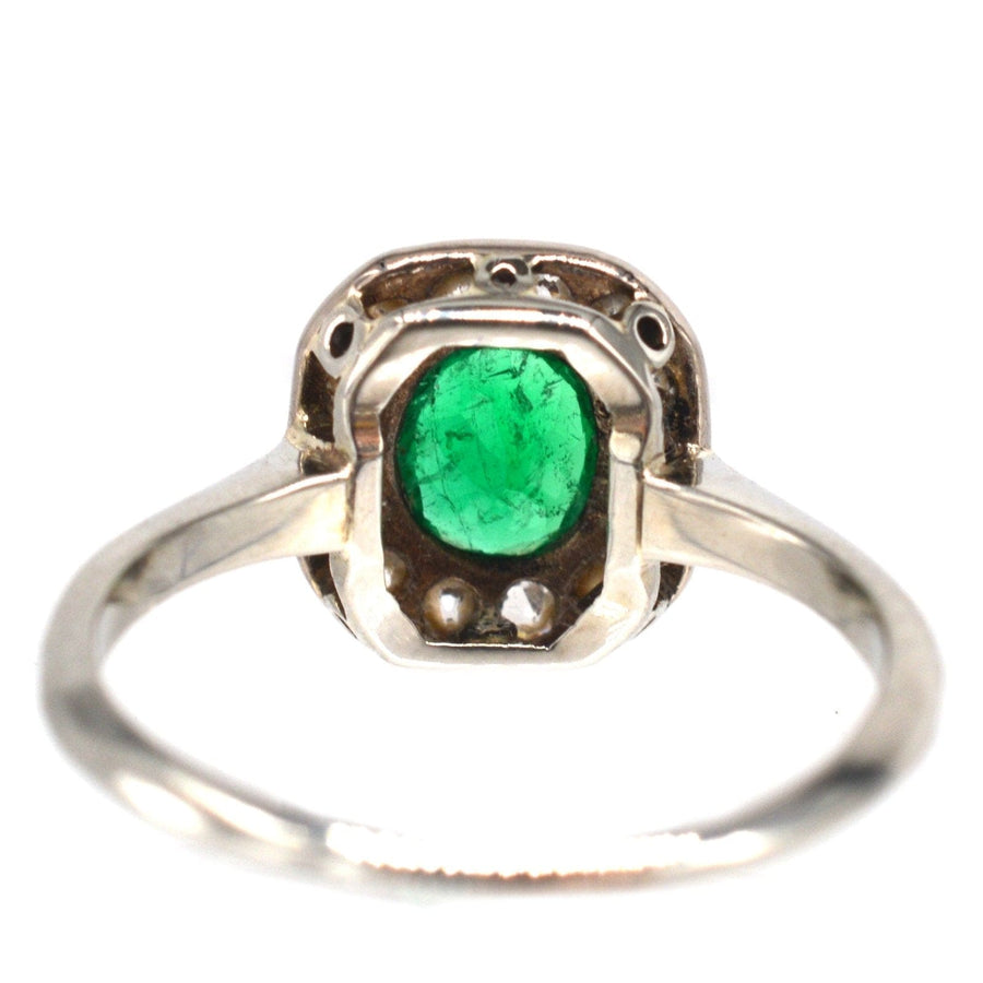Art Deco 18ct white gold emerald and diamond cluster ring with vibrant green emerald and diamonds.