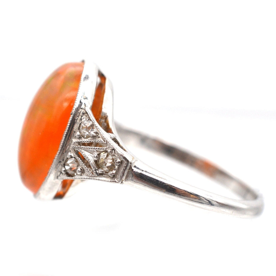 Art Deco 18ct White Gold & Platinum ring featuring a vibrant Mexican Fire Jelly Opal and diamond accents.