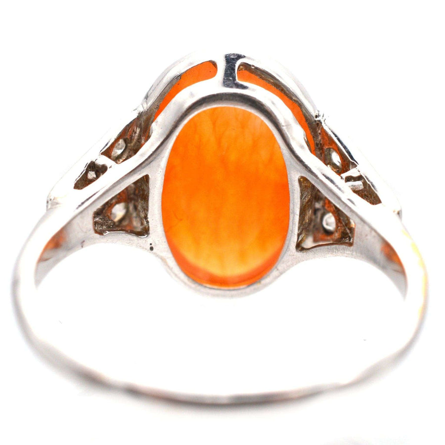 Art Deco 18ct white gold and platinum ring featuring a natural Mexican fire opal with orange and yellow hues.