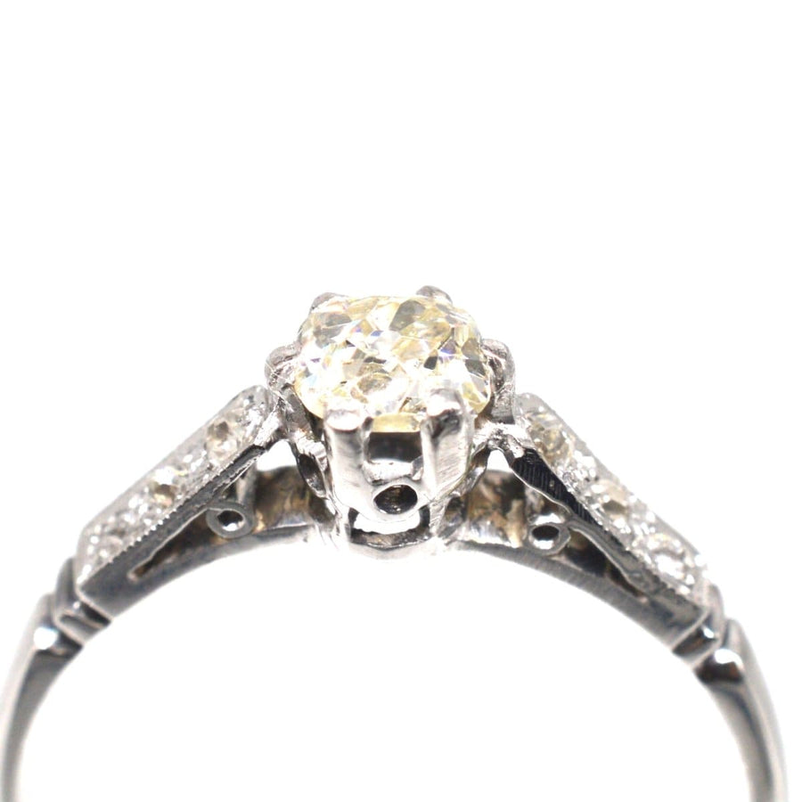 Art Deco 18ct white gold and platinum old mine cut diamond solitaire ring with side diamonds.