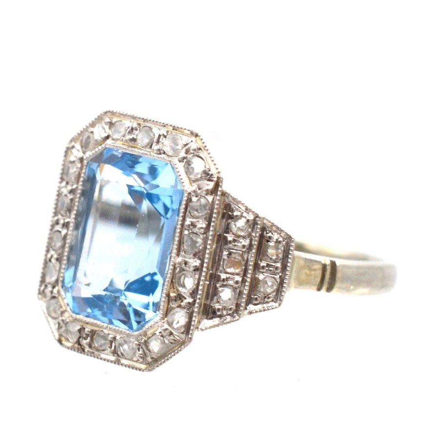Art Deco blue spinel and diamond ring with intricate details, suitable for engagement or cocktail wear.