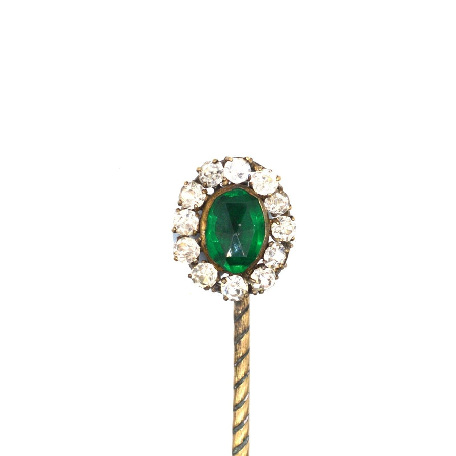 Art Deco green emerald and white paste tie pin, featuring a classic cluster design with sparkling stones.