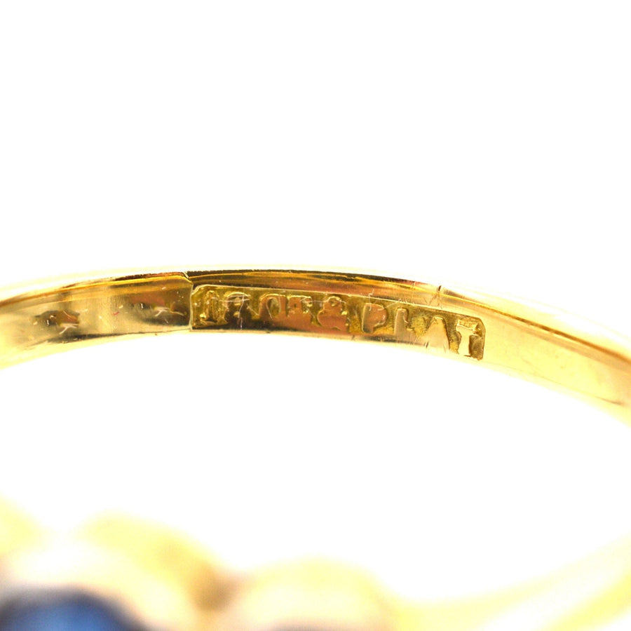 Platinum and 18ct gold ring interior with hallmark for authenticity, showcasing craftsmanship.
