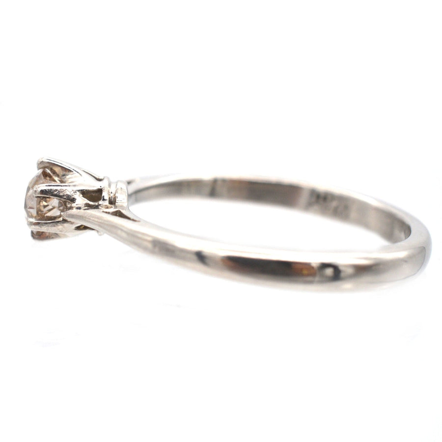 Art Deco platinum solitaire ring featuring an old mine cut Cognac diamond, showcasing its unique vintage charm.