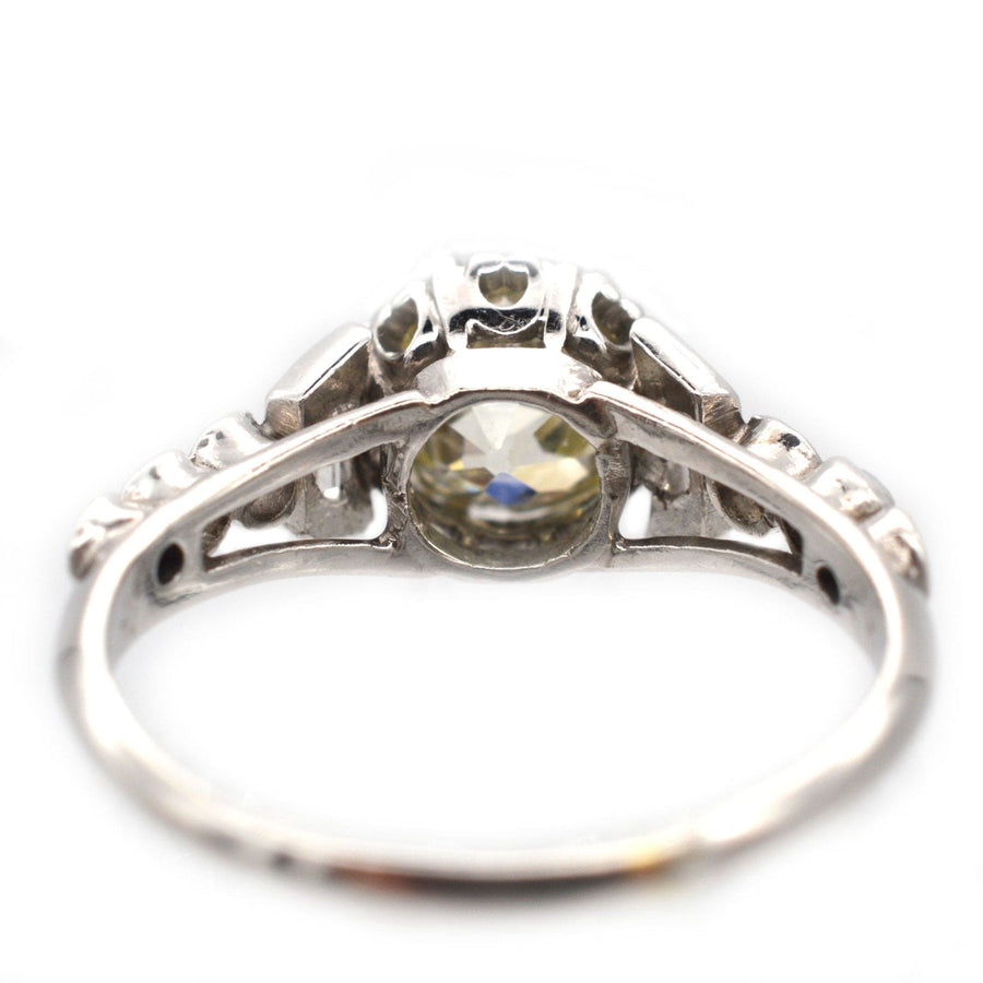 Art Deco platinum diamond solitaire ring showing intricate shoulders with unique diamond cuts, circa 1925.