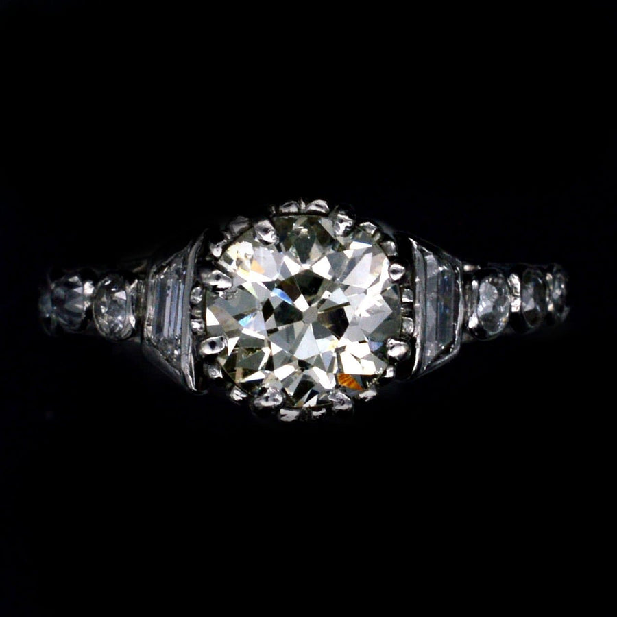 Art Deco platinum large diamond solitaire ring with diamond shoulders, circa 1925, showcasing vintage elegance.