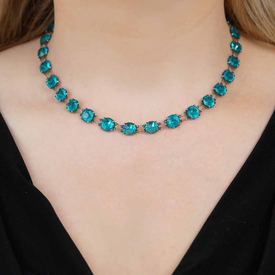 Art Deco silver necklace with lustrous blue paste stones in a stunning riviere design, perfect for adding color to any outfit.