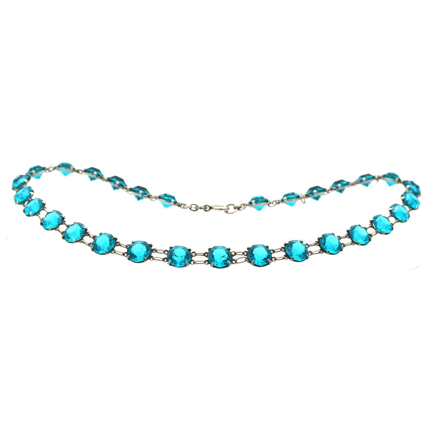 Art Deco silver necklace featuring lustrous blue paste stones set in sterling silver with double ring links.