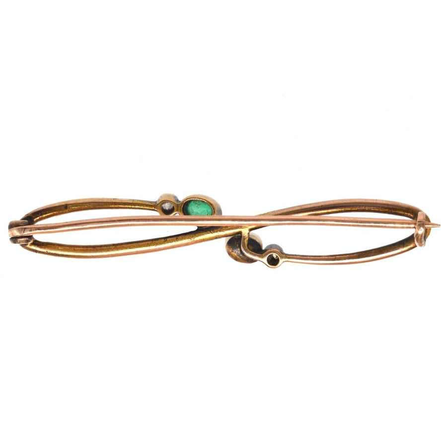 Art Nouveau 15ct gold brooch featuring cabochon emerald, pearl, and diamond accents, perfect for a lapel.