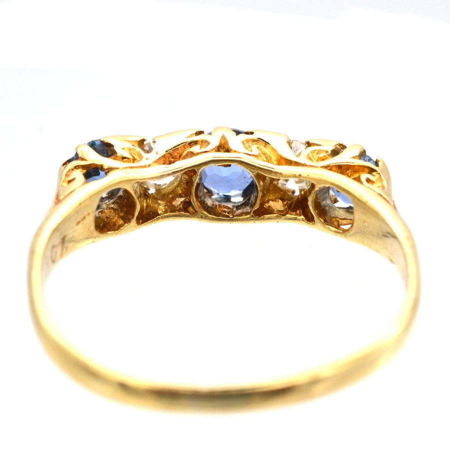Elegant Edwardian 15ct gold ring featuring cornflower sapphires and sparkling diamonds, perfect for engagements.