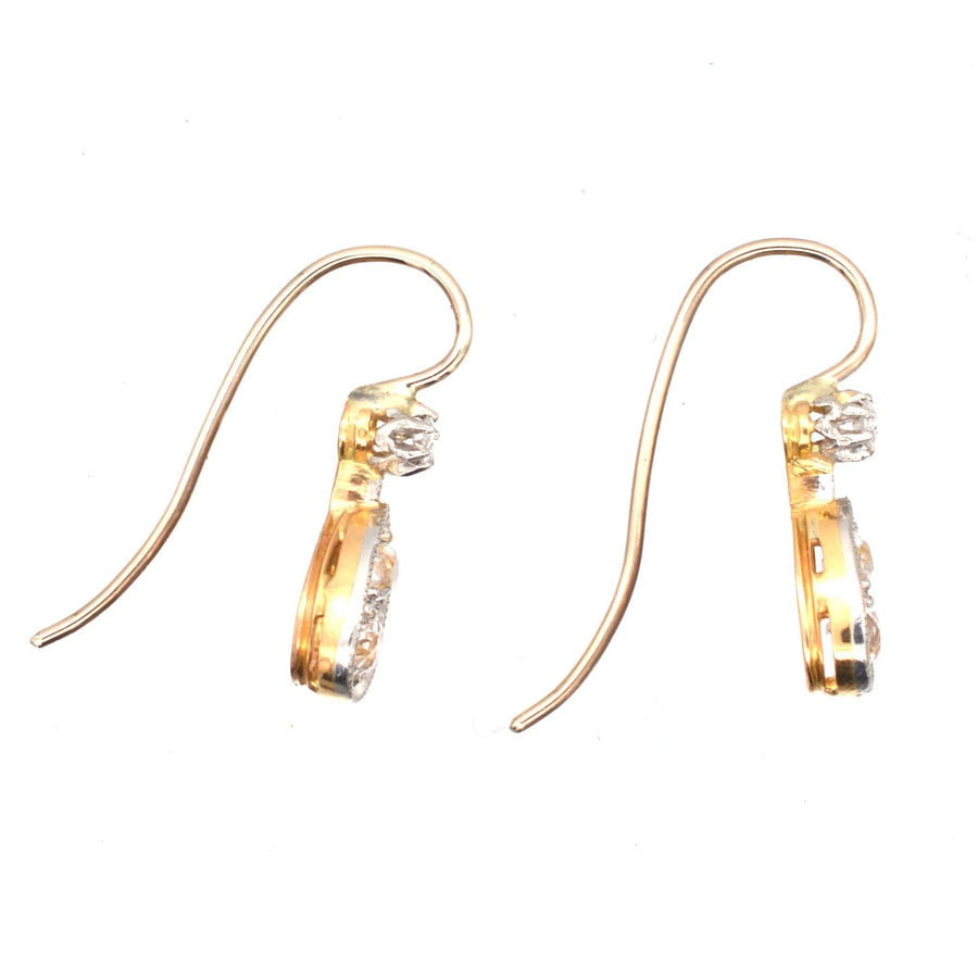 Edwardian 15ct gold and platinum drop earrings with old cut diamonds, classic antique jewelry from circa 1900.