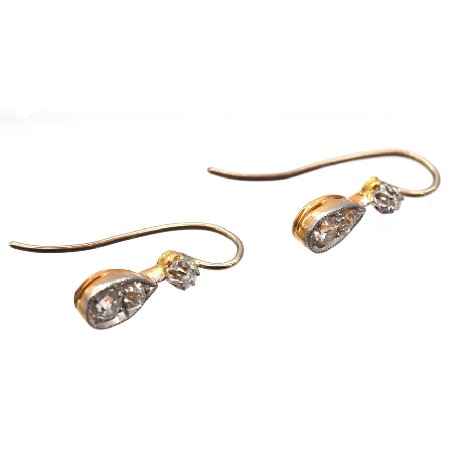 Edwardian 15ct gold and platinum drop earrings with old cut diamonds, circa 1900, featuring classic design and millegraining detail.