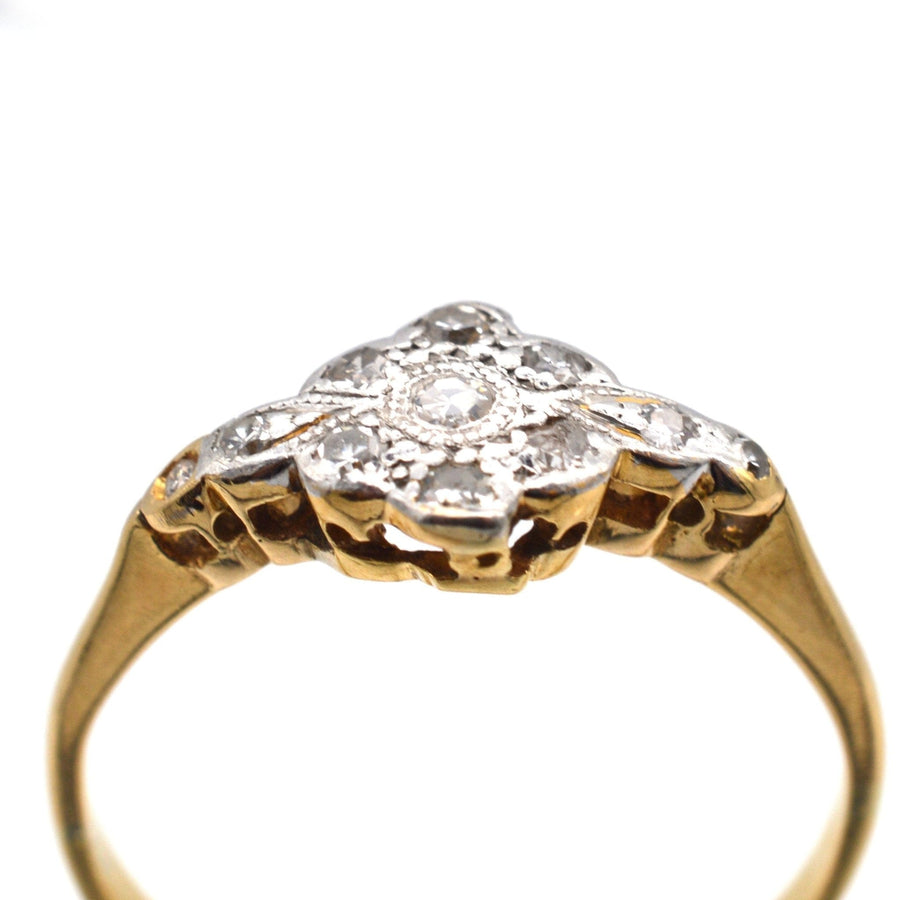 Edwardian 18ct gold and platinum diamond cluster ring featuring 0.20 carats of sparkling diamonds.