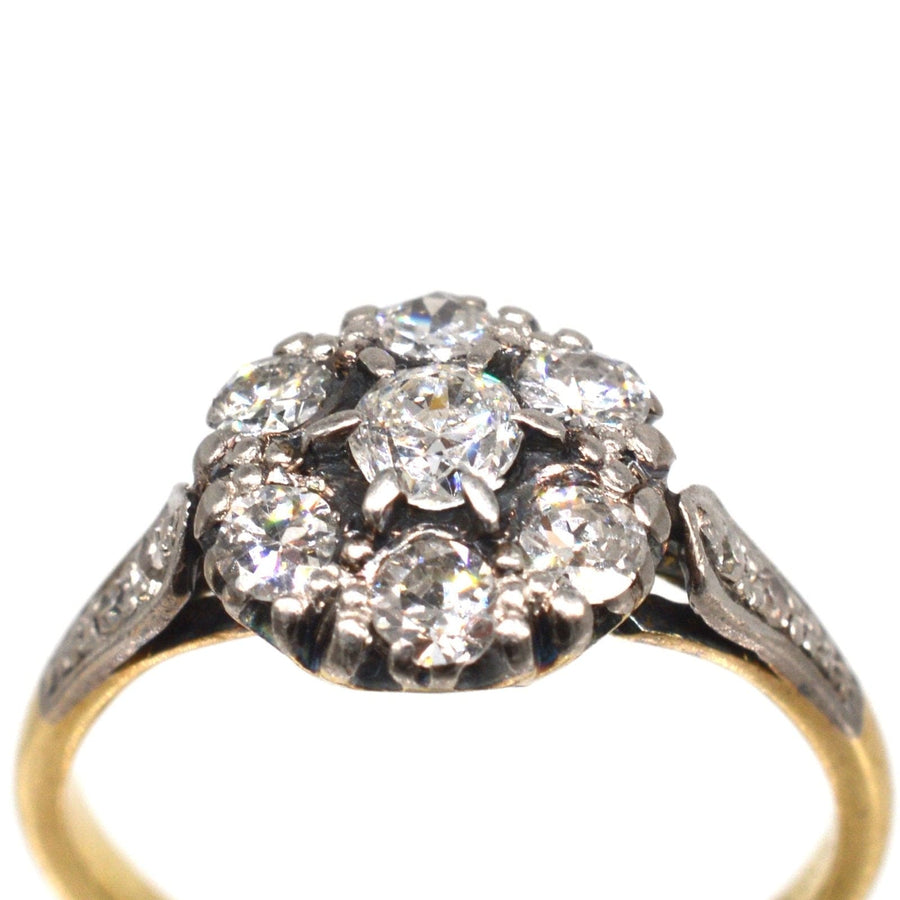 Edwardian 18ct gold and platinum diamond cluster ring featuring approx. 0.70 carats of sparkling diamonds.