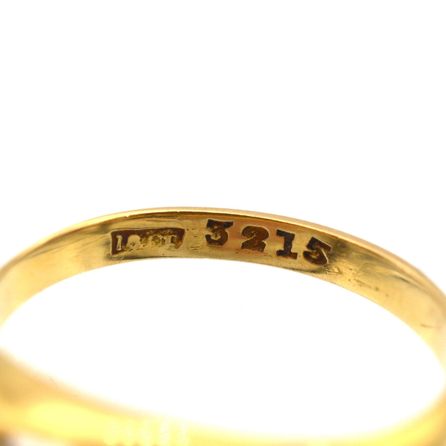 Engraved hallmark of Edwardian 18ct gold ring, displaying 5215 and purity markings.
