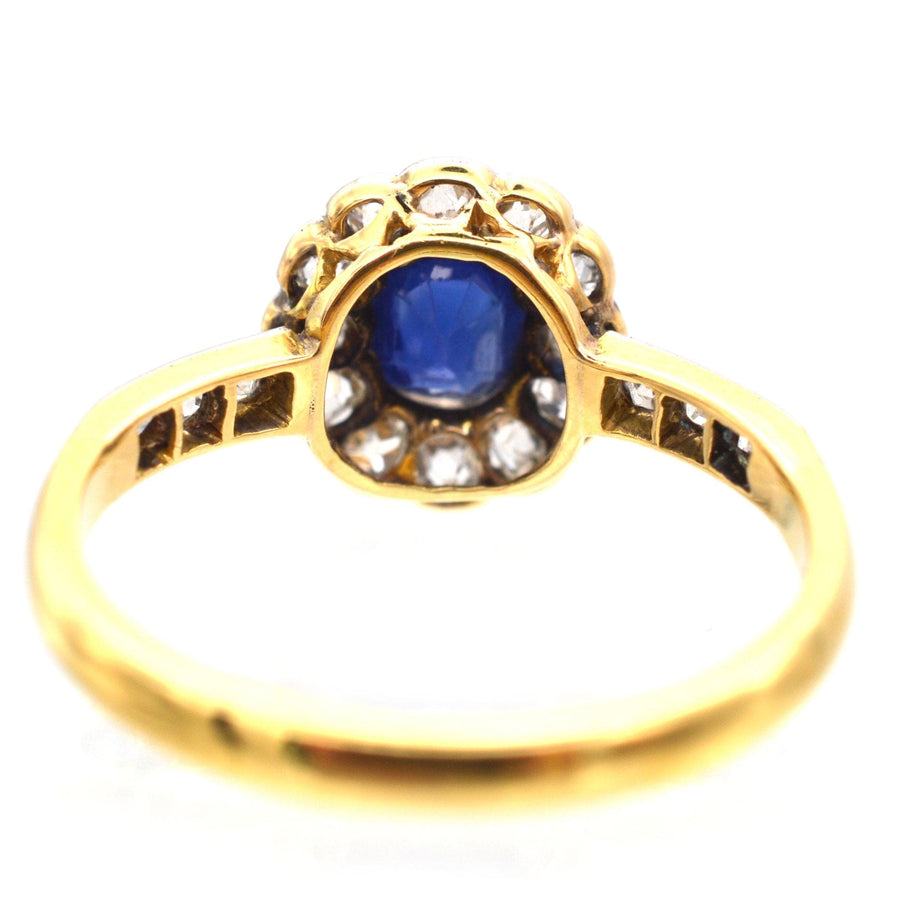 Edwardian 18ct gold sapphire and diamond cluster ring, featuring velvet blue sapphire and old cut diamonds.