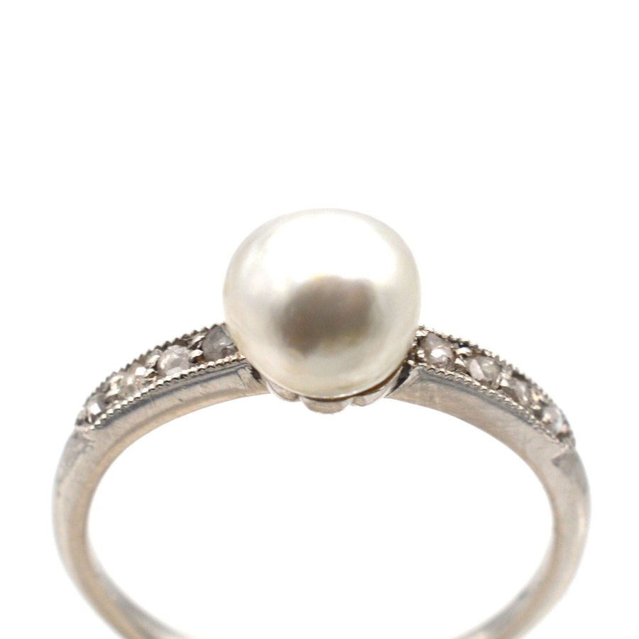 Edwardian 18ct white gold and platinum ring with large natural pearl and diamond shoulders.