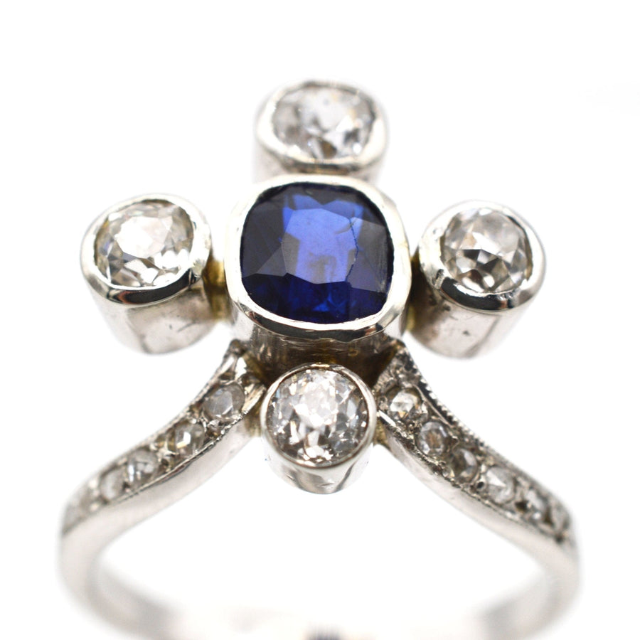 Edwardian 18ct white gold tiara ring featuring a natural blue sapphire and brilliant diamonds.