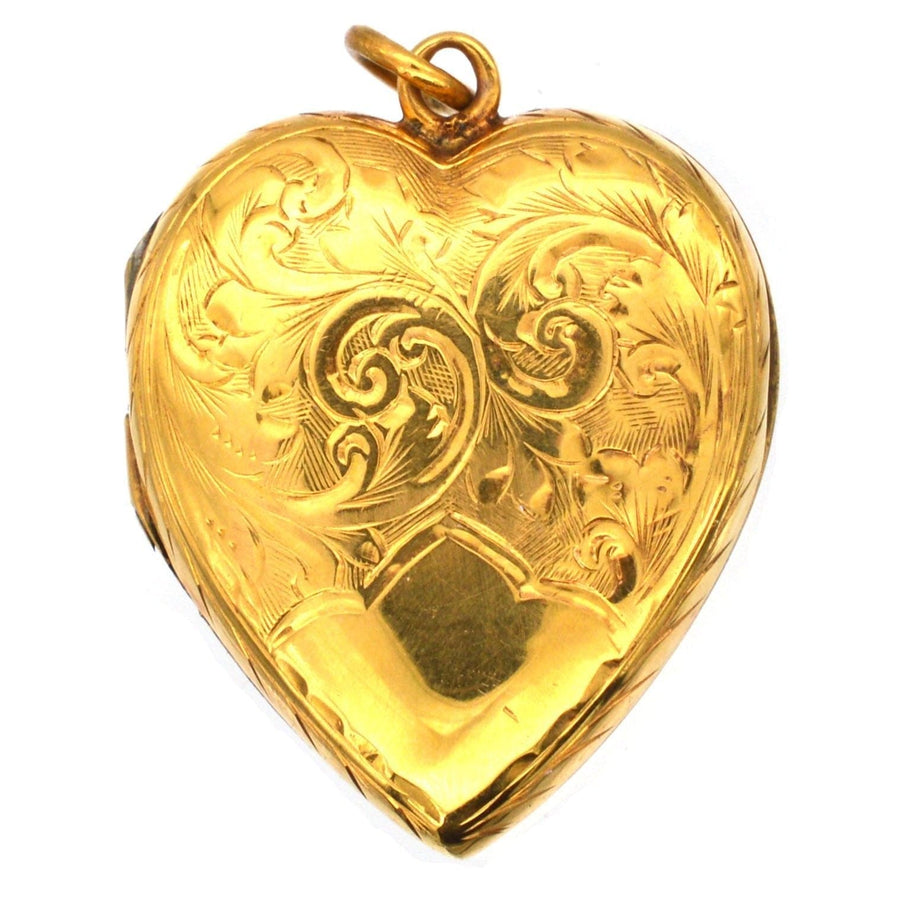 Edwardian heart-shaped 9ct gold locket pendant with engraved scroll motifs, circa 1900-1910.