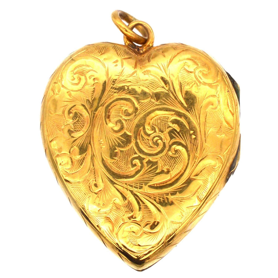 Vintage 9ct gold heart locket pendant with intricate engraved scroll motifs from circa 1900-1910.