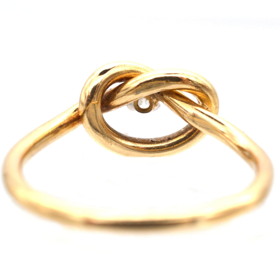 9ct gold diamond lovers' knot ring symbolizing infinite love and friendship.