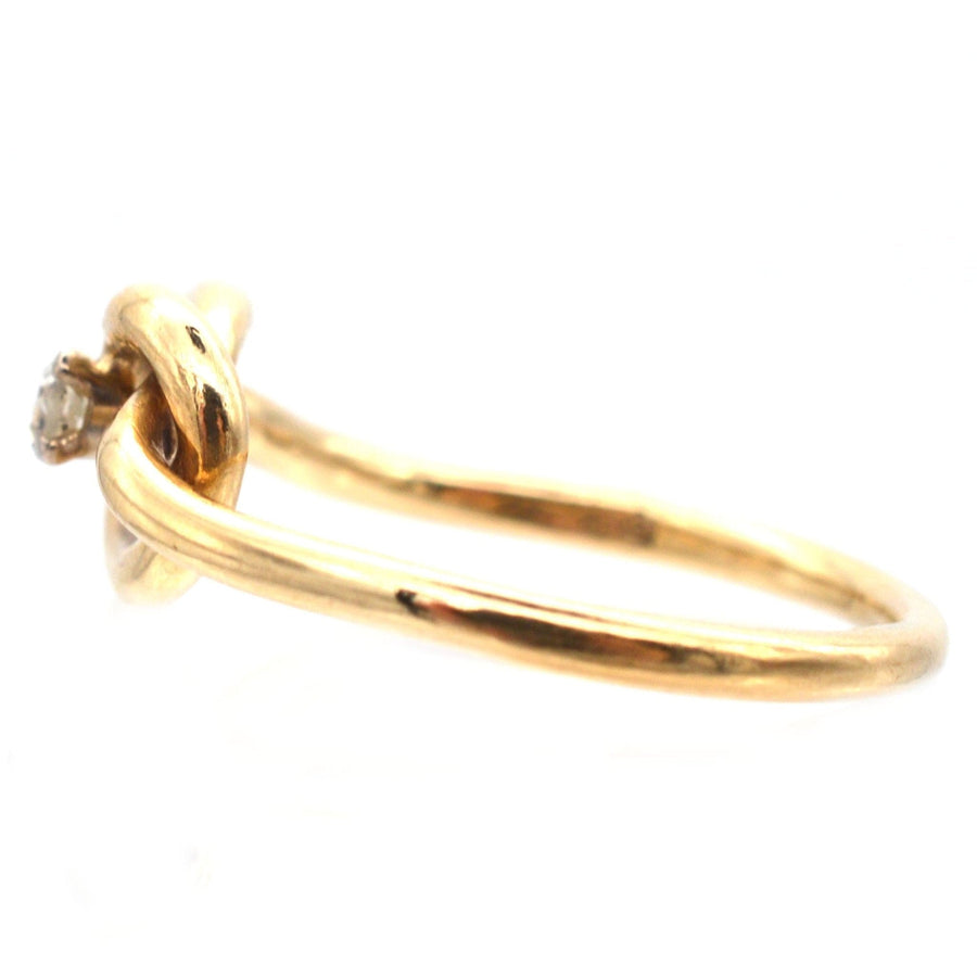 Elegant 9ct gold diamond lovers' knot ring symbolizing infinite love and connection.