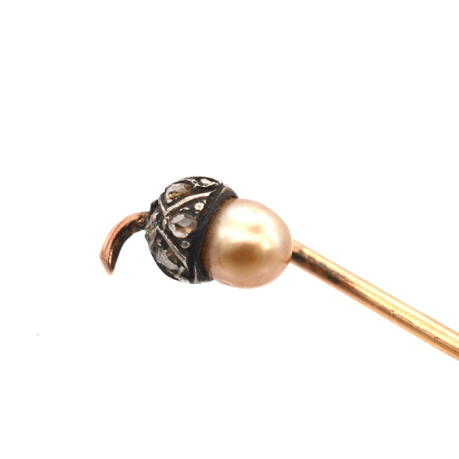 Edwardian 9ct gold and silver acorn tie pin with diamond and natural pearl, symbolizing new beginnings.
