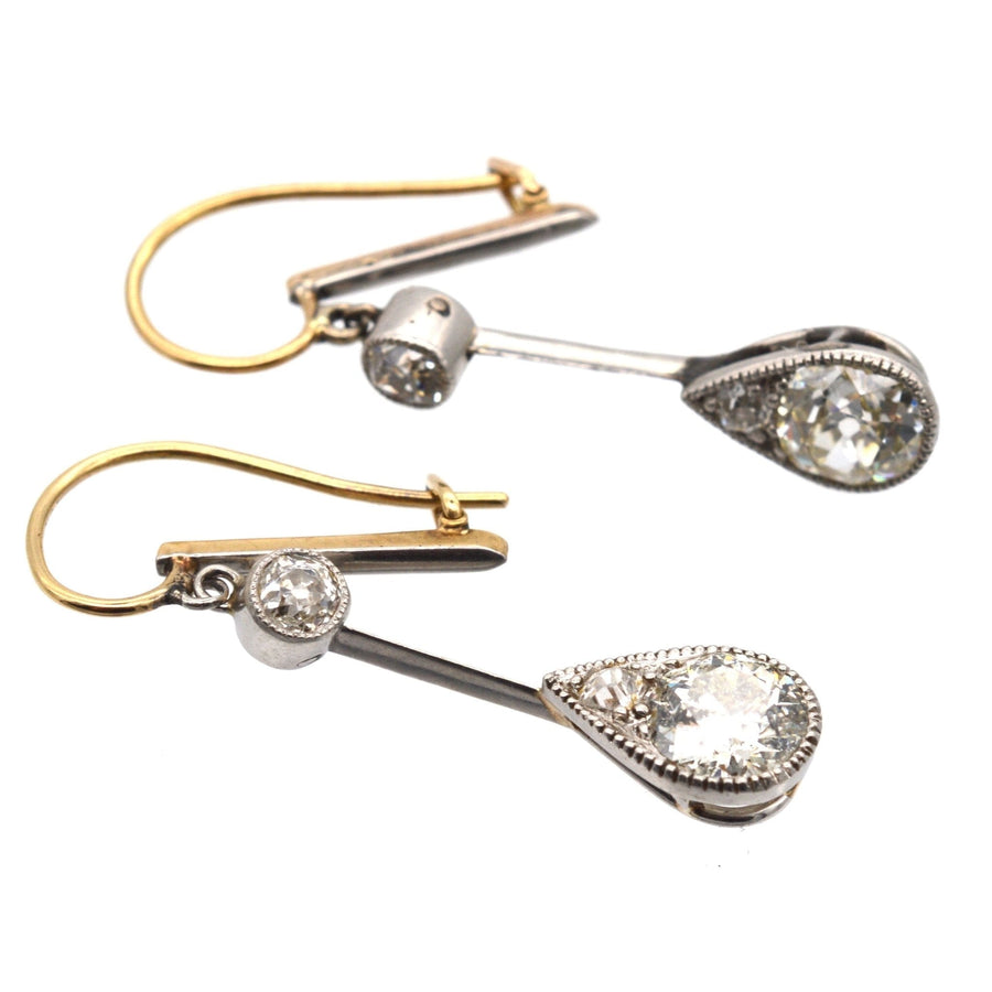 Edwardian diamond drop earrings in platinum and gold with pear-shaped design and old cut diamonds.