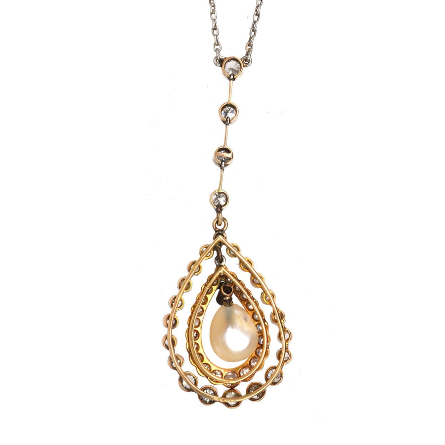 Edwardian-era platinum and 18ct gold pendant with saltwater pearl and diamonds on a chain necklace.