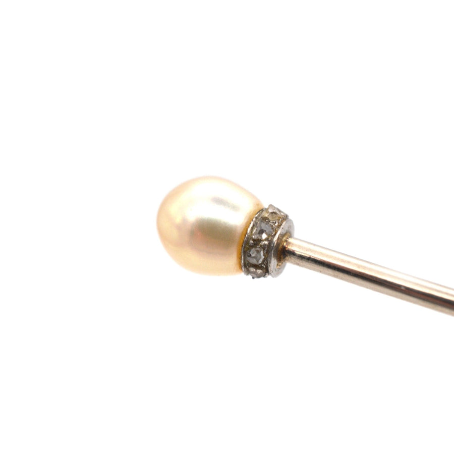 Edwardian platinum tie pin featuring a lustrous natural pearl and sparkling rose diamonds, perfect for silk ties.
