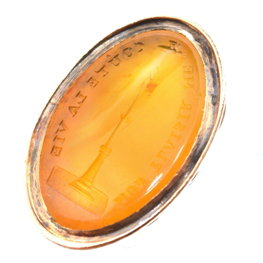Georgian 9ct gold carnelian seal featuring intaglio of a moth and candle flame, engraved with a pun.