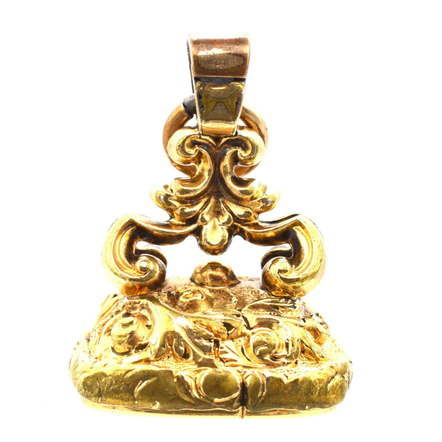 Georgian gold cased seal with intricate floral design, featuring a citrine intaglio monogram 'SC', c. 1820.