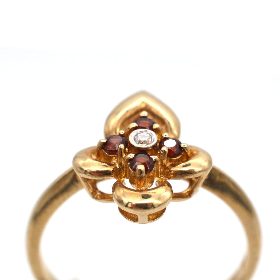 Late 20th Century 18ct gold ring featuring hessonite garnets and a diamond, resembling a cinnamon stone.
