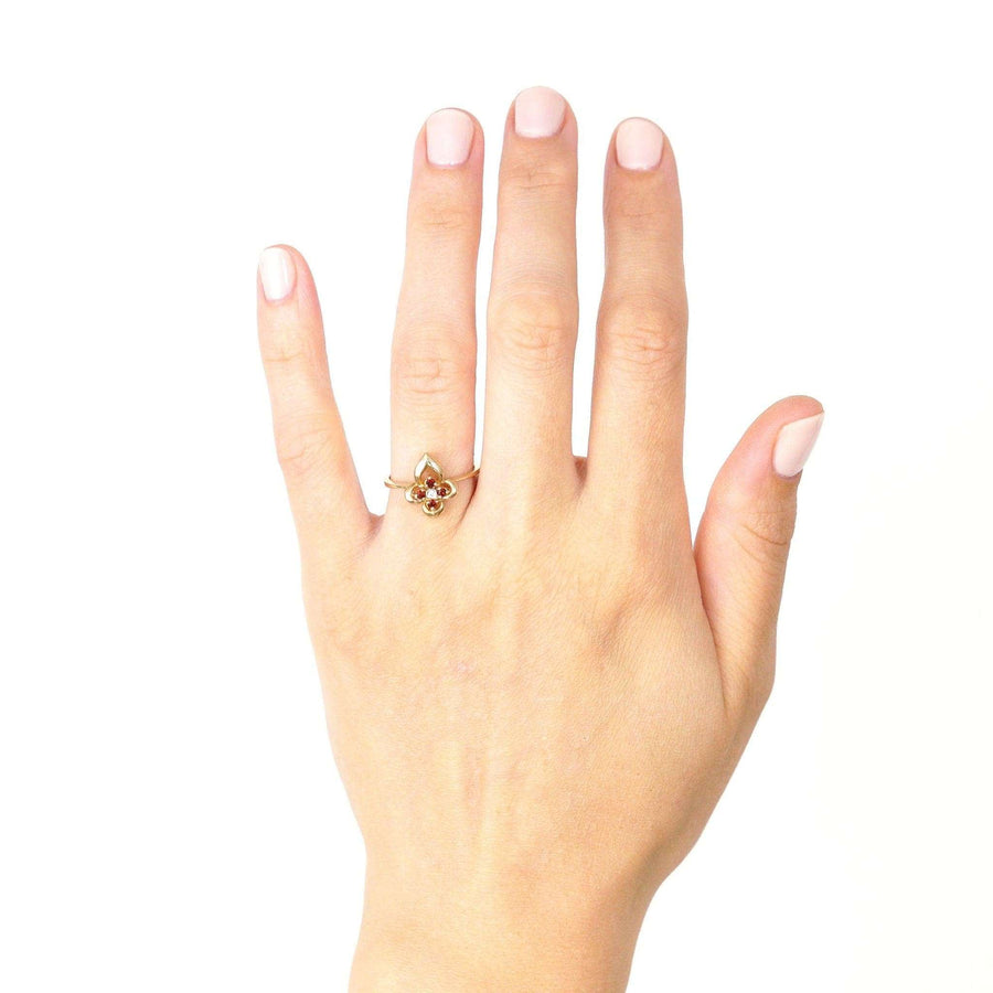 Late 20th century 18ct gold ring featuring hessonite garnet and diamond, displayed on a hand.